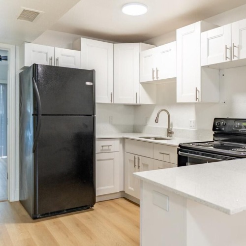 a kitchen with white cabinets