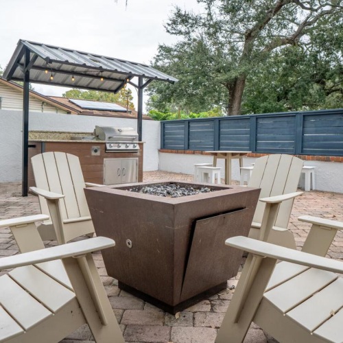 a fire pit with chairs