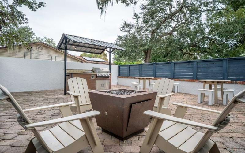 a fire pit with chairs