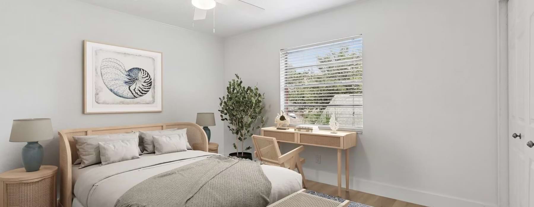 a bedroom with a bed and tables